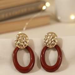 Beautiful ear hanging maroon and gold toned